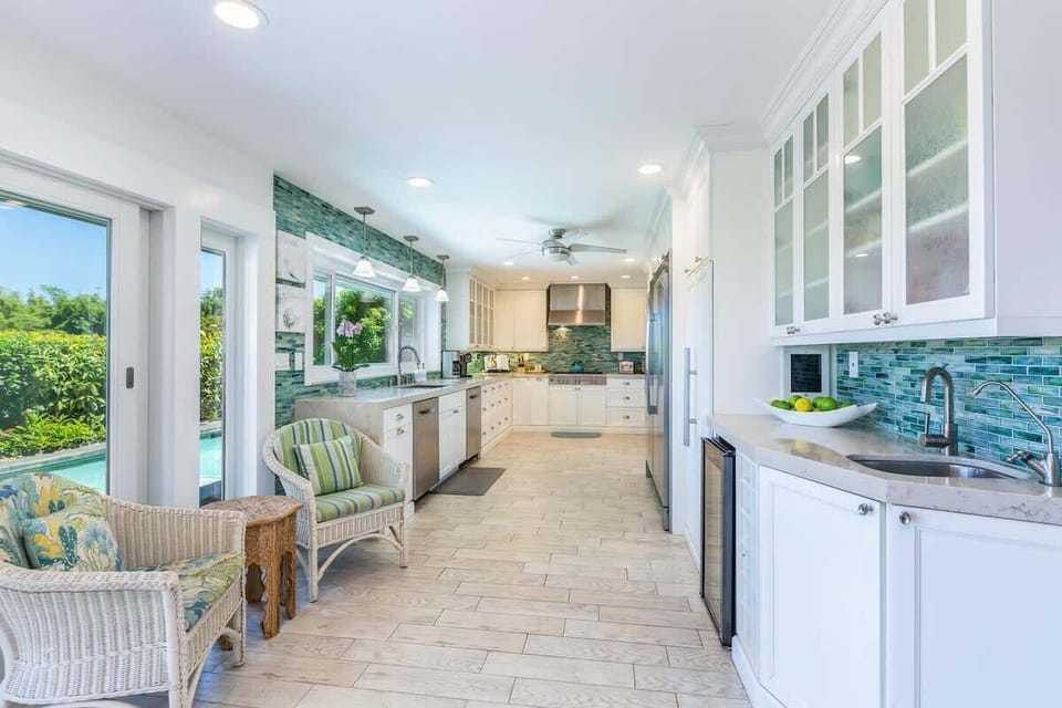 A modern, ocean-toned kitchen with all the essentials—spacious, breezy, and fully equipped for your stay.