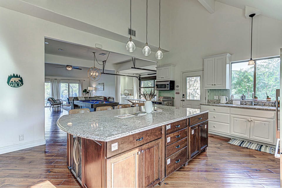Chef's kitchen with granite counters and stainless appliances 