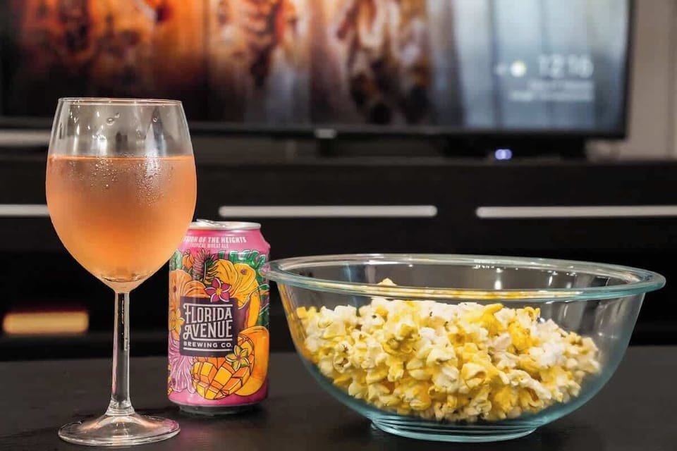 Unwind with popcorn and your favorite drink for a relaxing movie night on the comfortable sectional