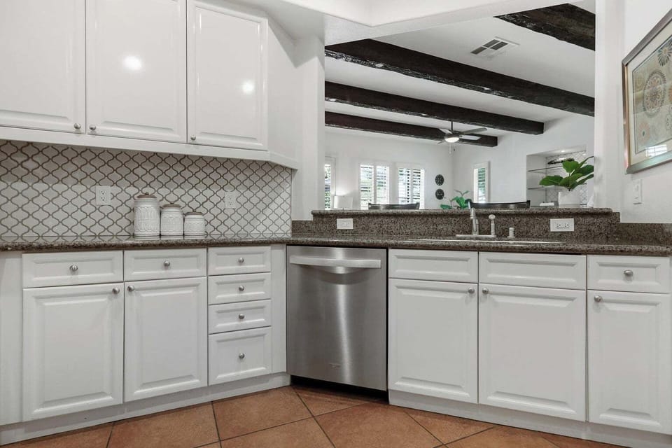 View of Breakfast bar from the kitchen side. Full-size dishwasher. 