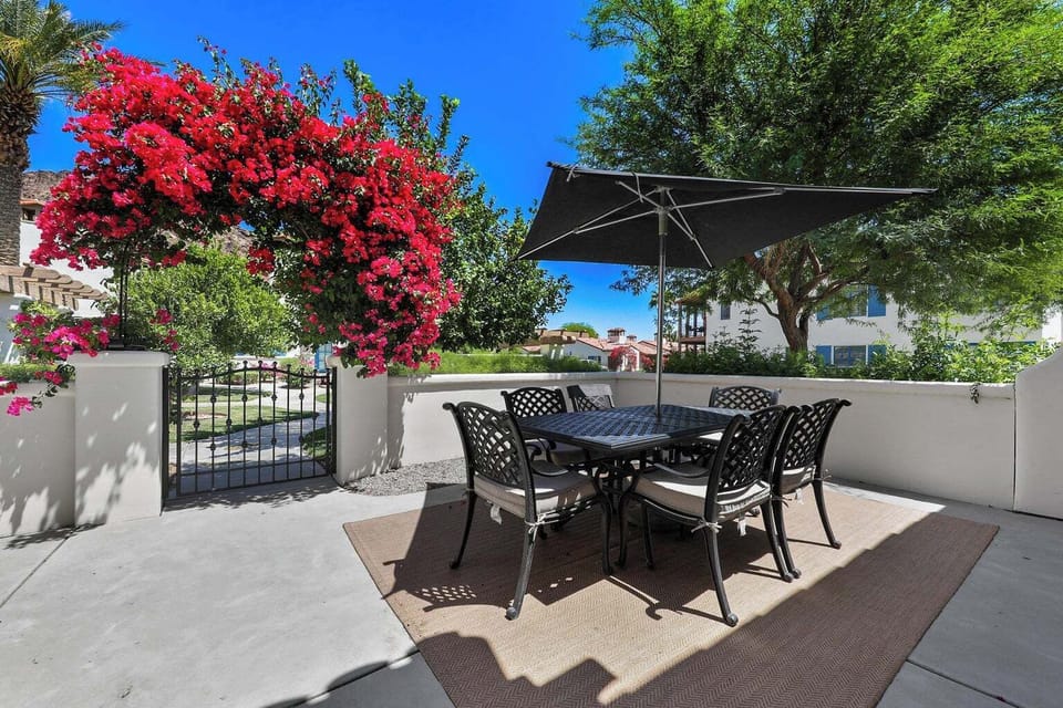 Outdoor dining table offers al fresco seating for six in an enclosed patio.