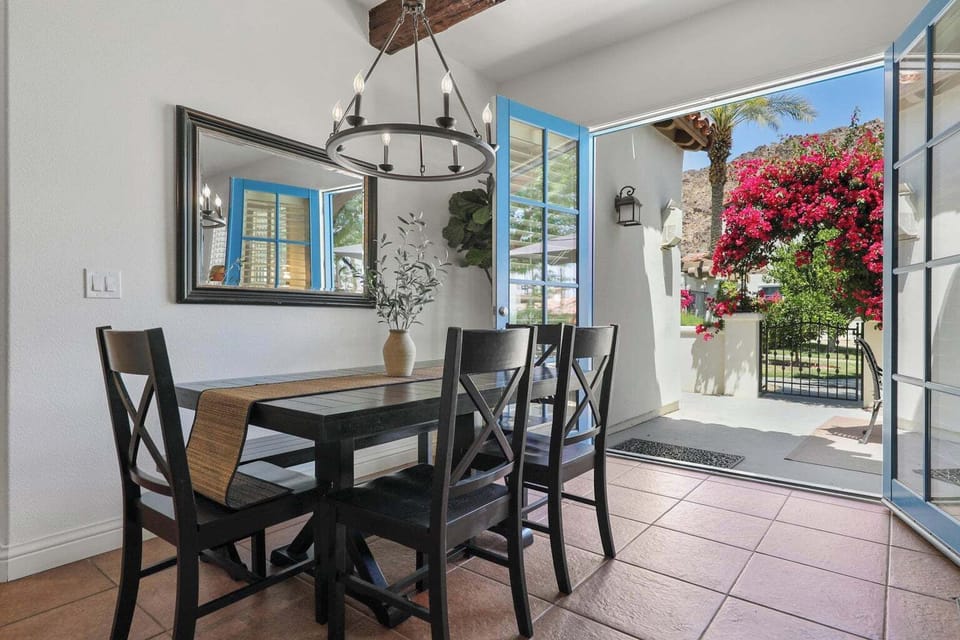 Dining Table has a long bench on one side and four (4) dining chairs.