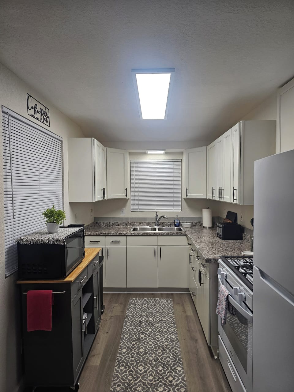Full kitchen with gas range and refrigerator. Cooking & Eating Utensil.