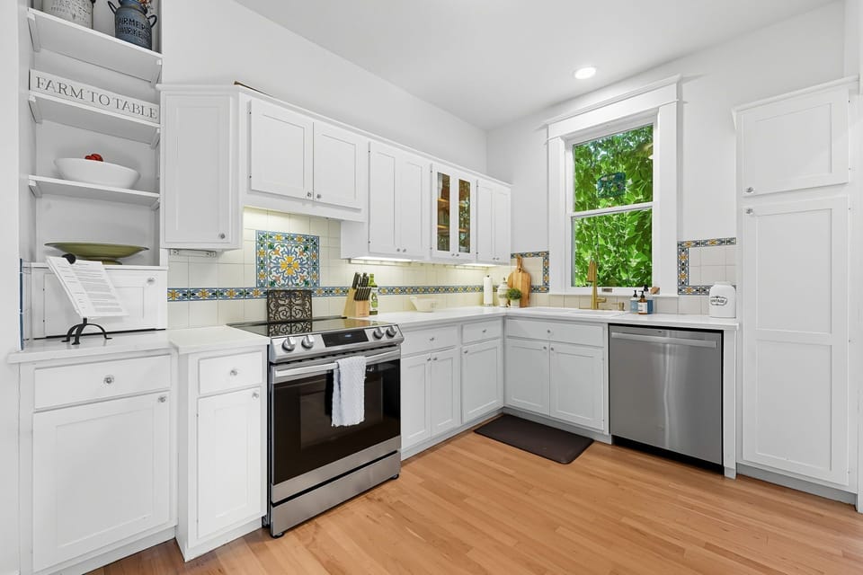 Updated fully equipped kitchen featuring new stainless steel appliances 