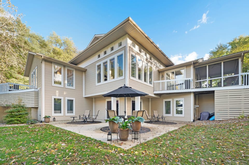 Lakefront side of house with patio.