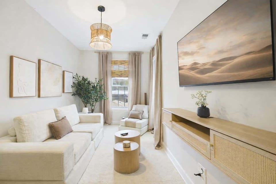 Living Room Retreat: Bright space with stylish decor, perfect for relaxing or enjoying a movie!