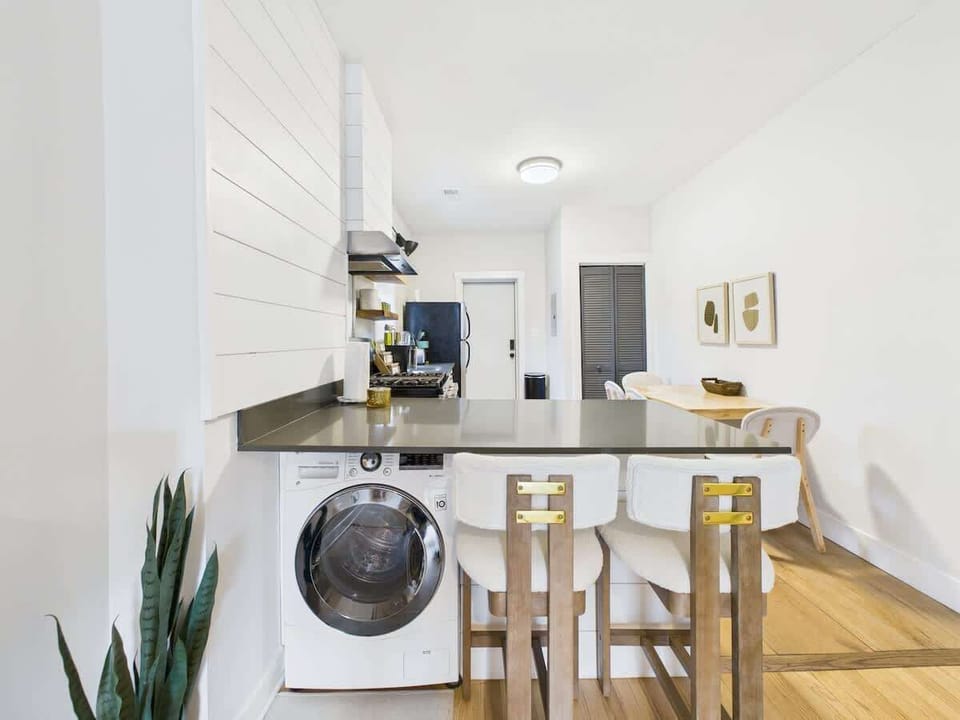 Kitchen: Modern space with sleek appliances and a casual dining area for unforgettable meals!