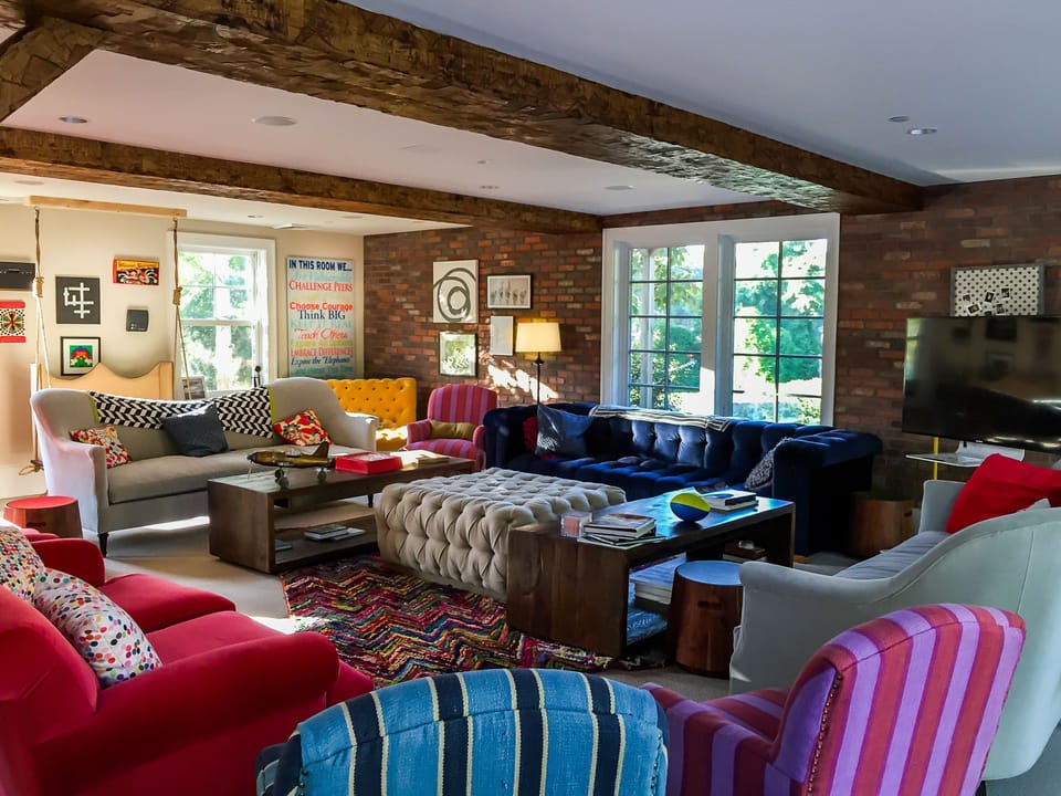 Eclectic furnishings and vibrant décor create a cozy hideaway for unwinding with friends or colleagues.