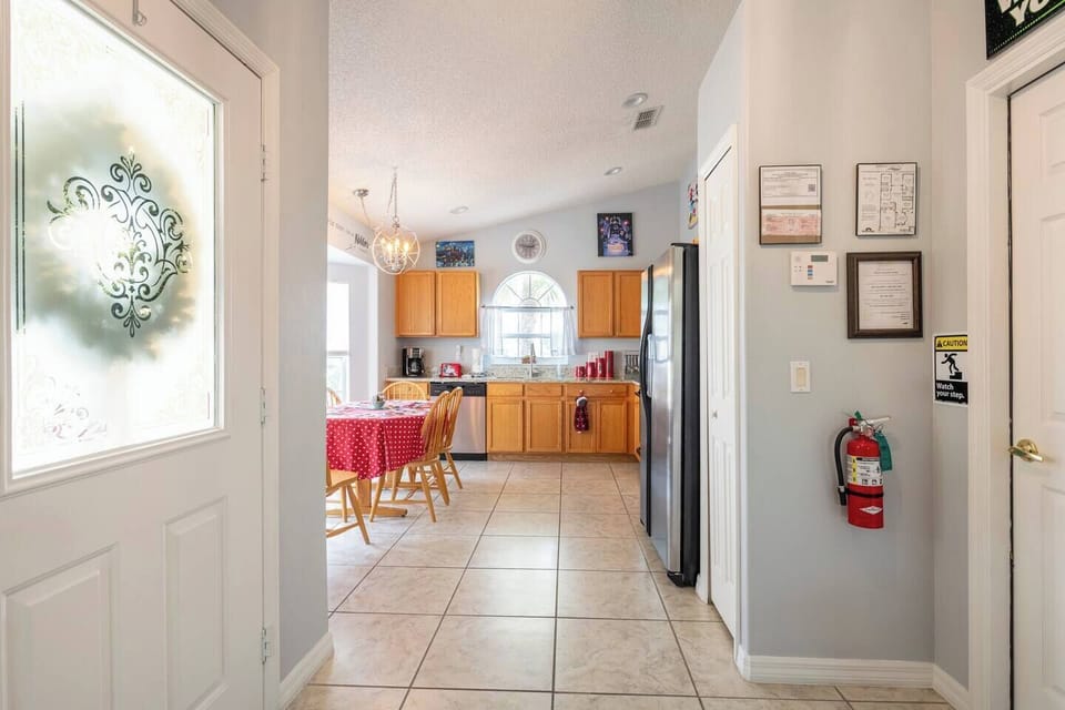 Kitchen area with seating for six.  Additional high chair in the garage.