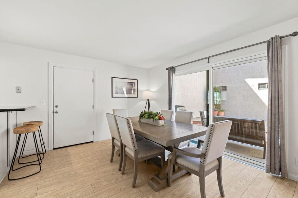 Gather around the dining table just steps from the private patio and kitchen.