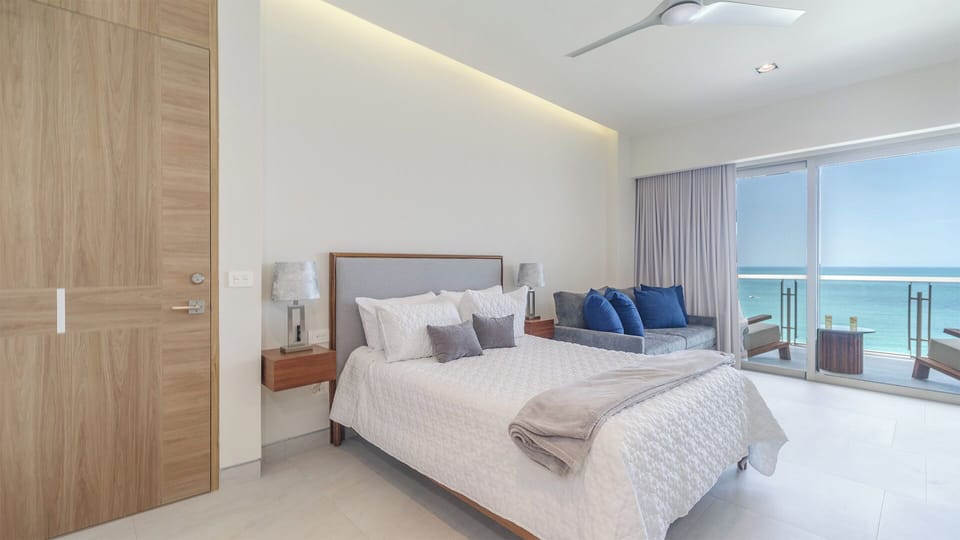 Relax in a stylish bedroom with a plush queen bed — perfect for a restful night's sleep while enjoying your stay