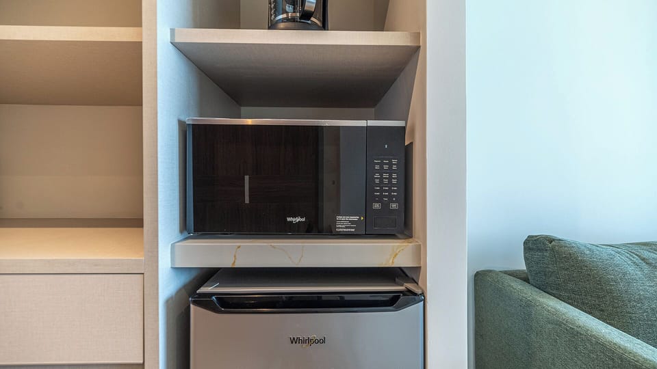 The kitchenette has a microwave, coffee maker, and refrigerator