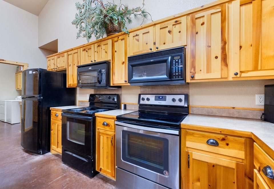 A well-equipped kitchen with double ovens and ample counter space makes hosting effortless and fun.