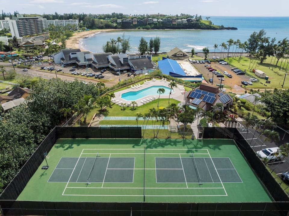 Soak up island vibes with pool, courts, and ocean views.