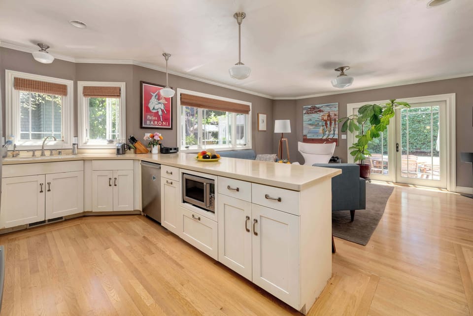 ... and further on is the kitchen, with ample counter space, appliances, and all the cookware you need.