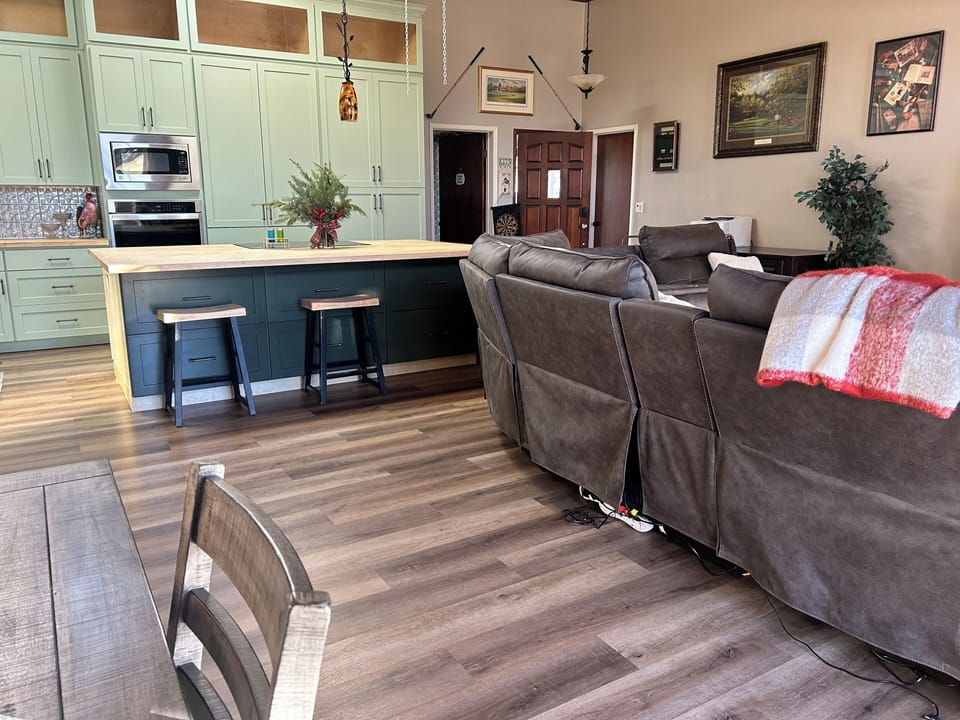 Another view of living room and kitchen
