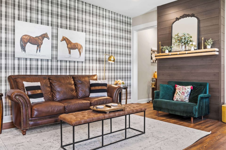 Living Room: Every detail thoughtfully chosen for your comfort. From the plush leather seating to the charming decor, our living room is a sanctuary waiting for you to make memories. 