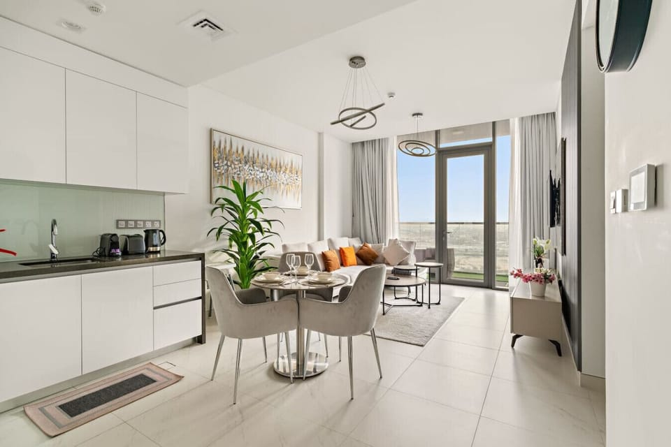 Bright, elegant space for dining and lounging, filled with natural light.