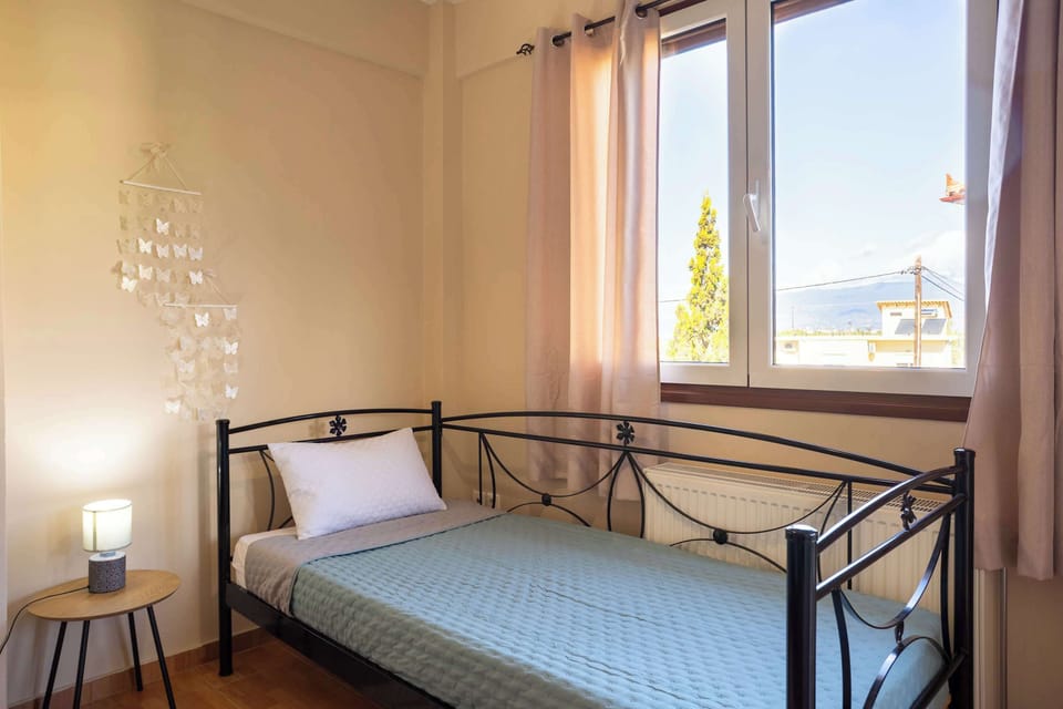 Bedroom with Balcony Access and Open Neighborhood Views, Offering a Bright and Airy Feel