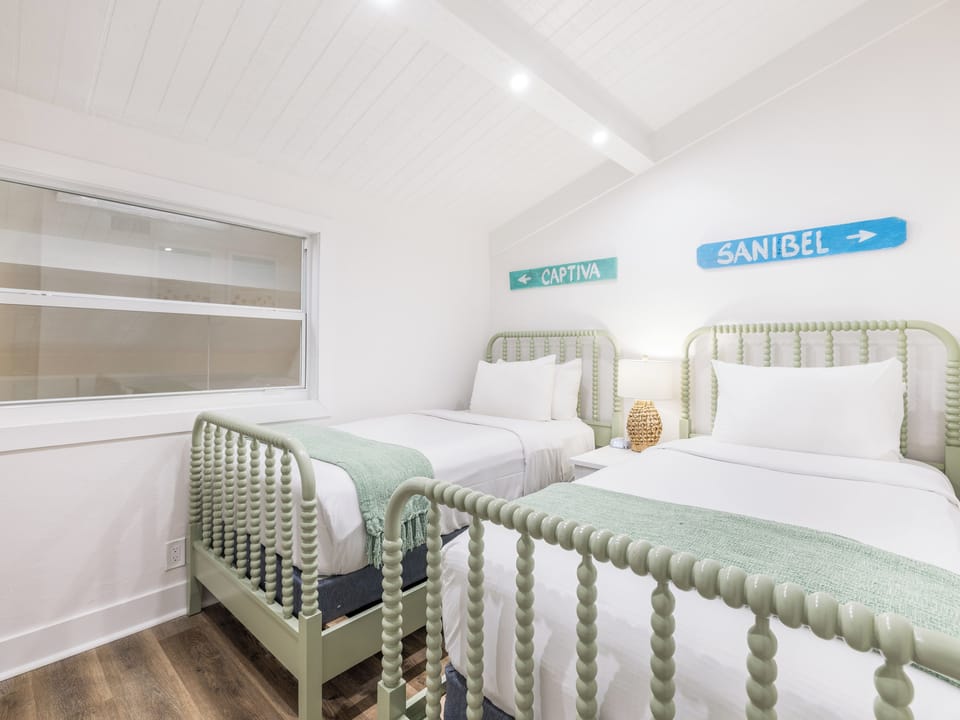Unwind in crisp twin beds with breezy coastal charm.