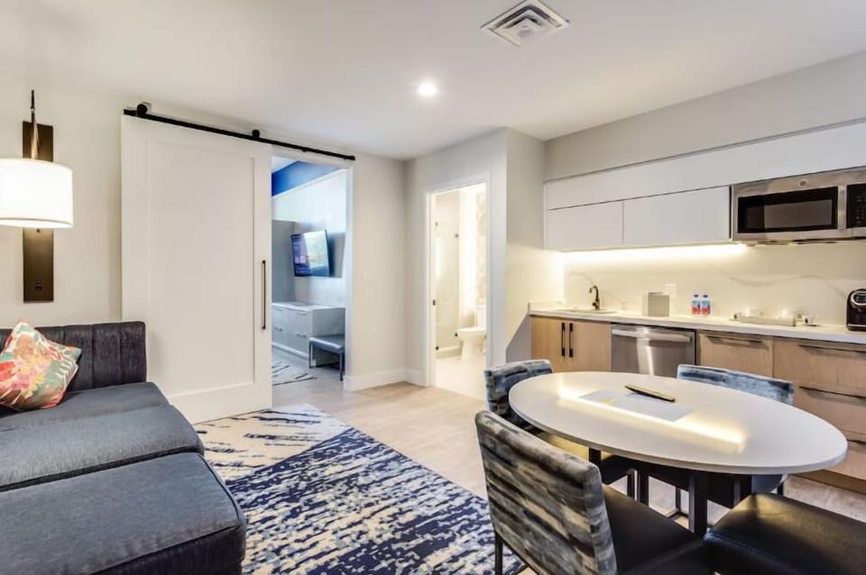 Sip morning coffee at the table beside your sleek kitchenette.