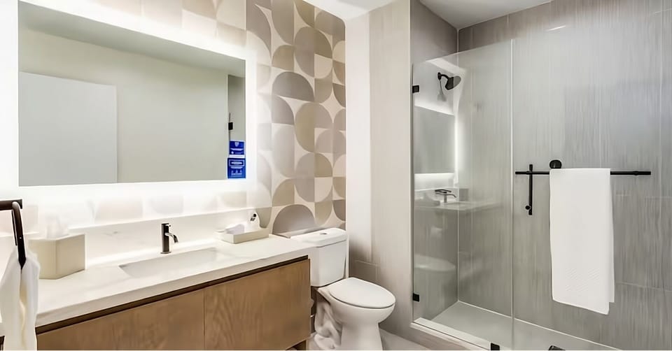 Refresh in a sleek, spa-like bath with glass shower.