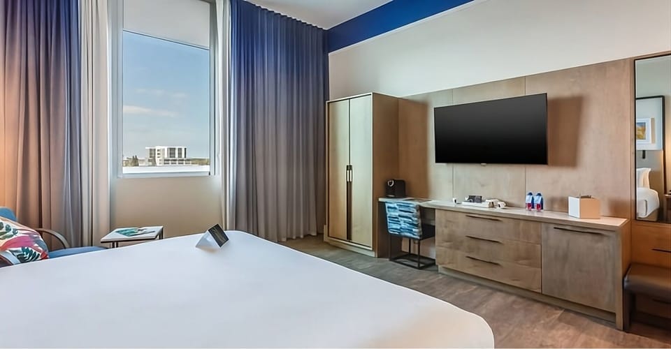 Kick back with big-screen entertainment and tidy in-room storage.