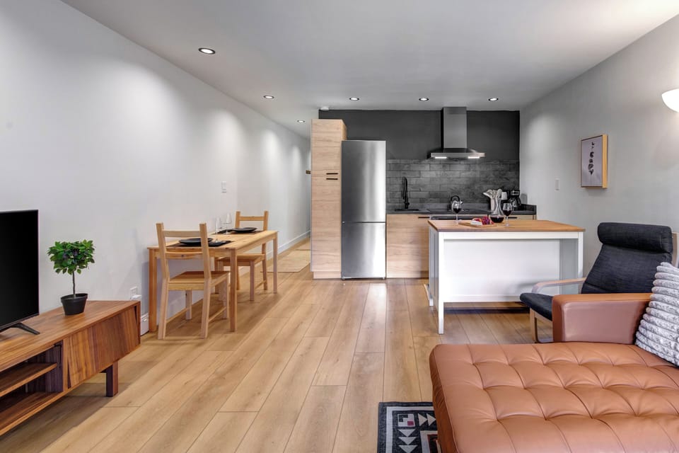 The open concept space with living, dining and kitchen area.