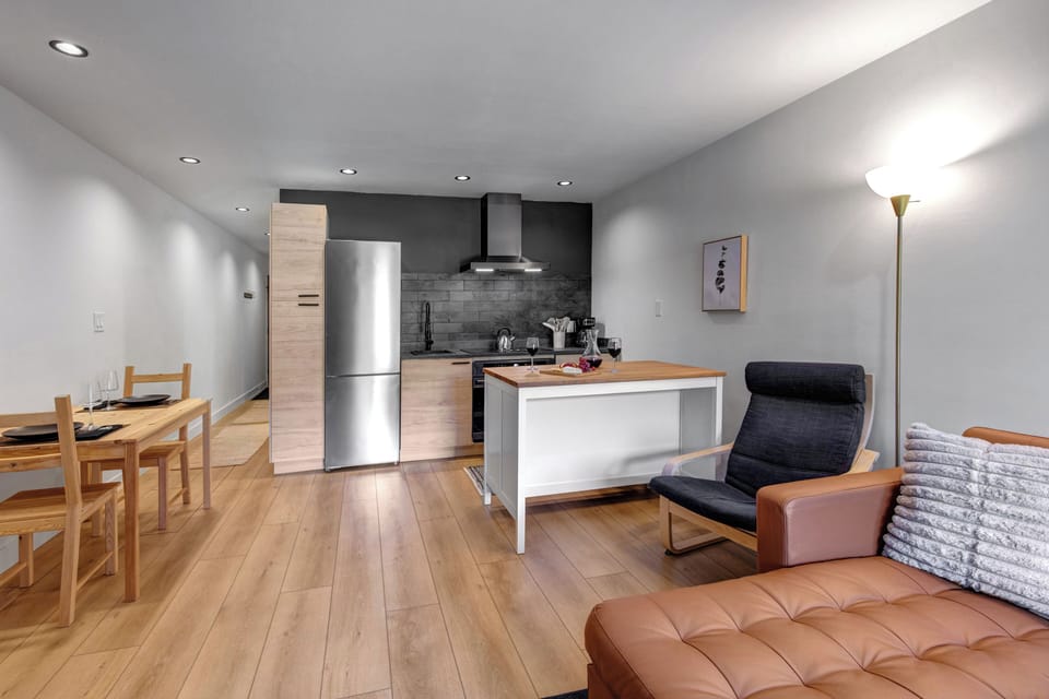 The open concept space with living, dining and kitchen area.