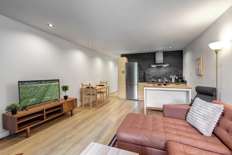 The open concept space with living, dining and kitchen area.