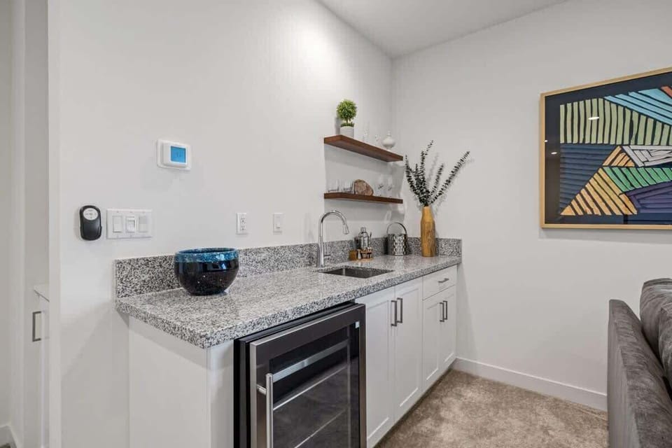 Fully equipped kitchen with stainless steel appliances and sleek finishes