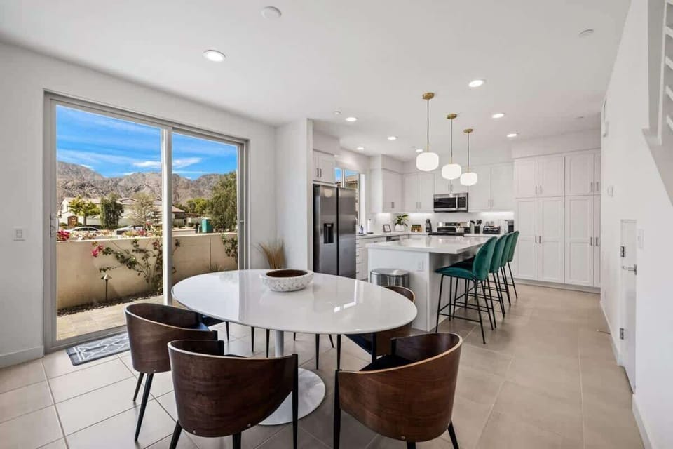 Elegant dining space with natural light and room for everyone to gather