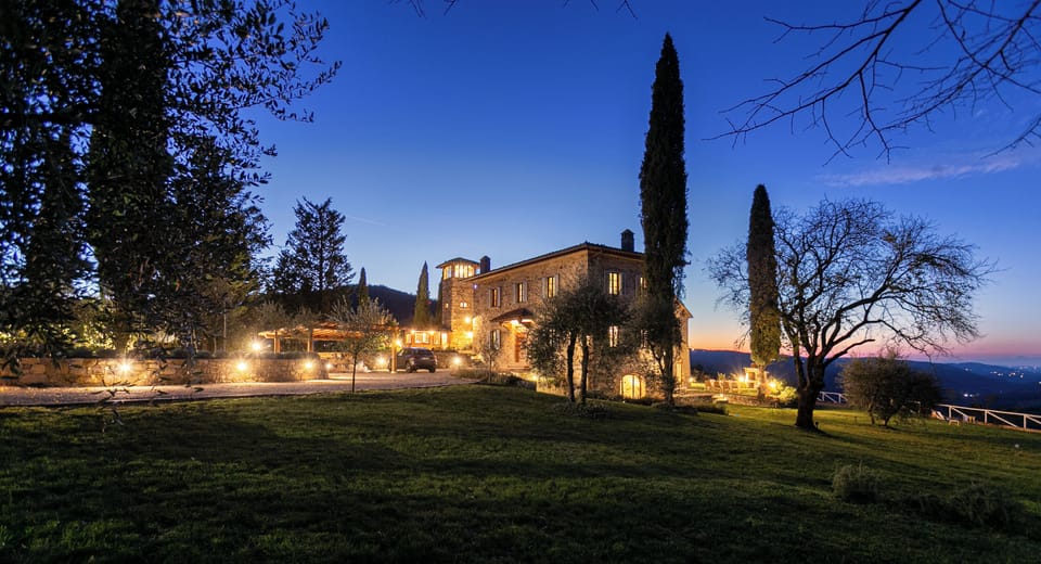 Villa with a blue-hued night sky