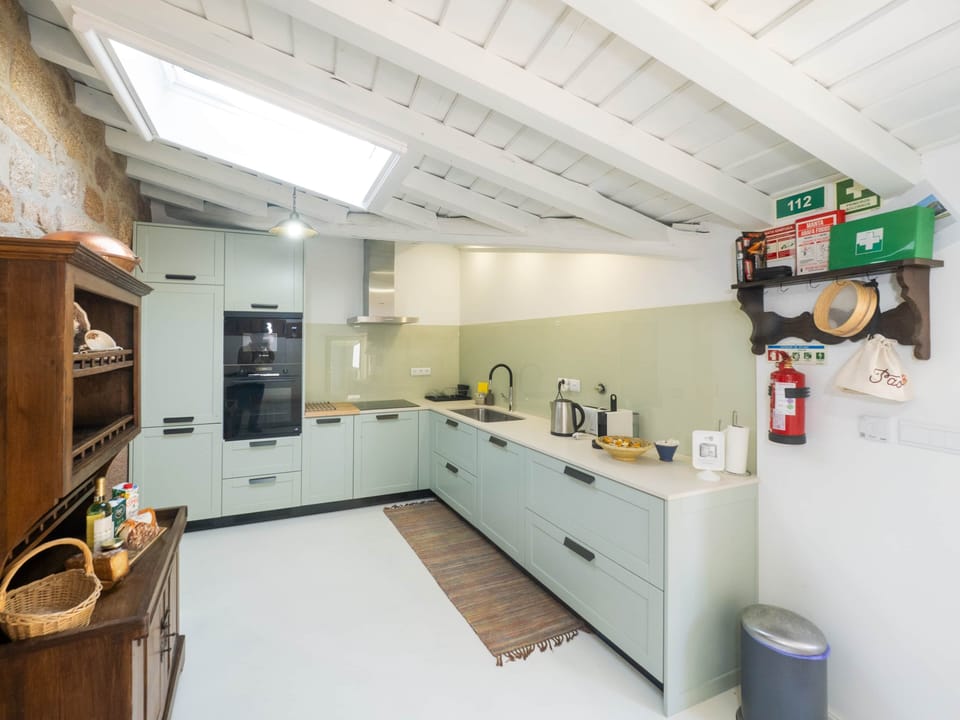 The sleek, modern kitchen has everything you need to prepare delicious meals.