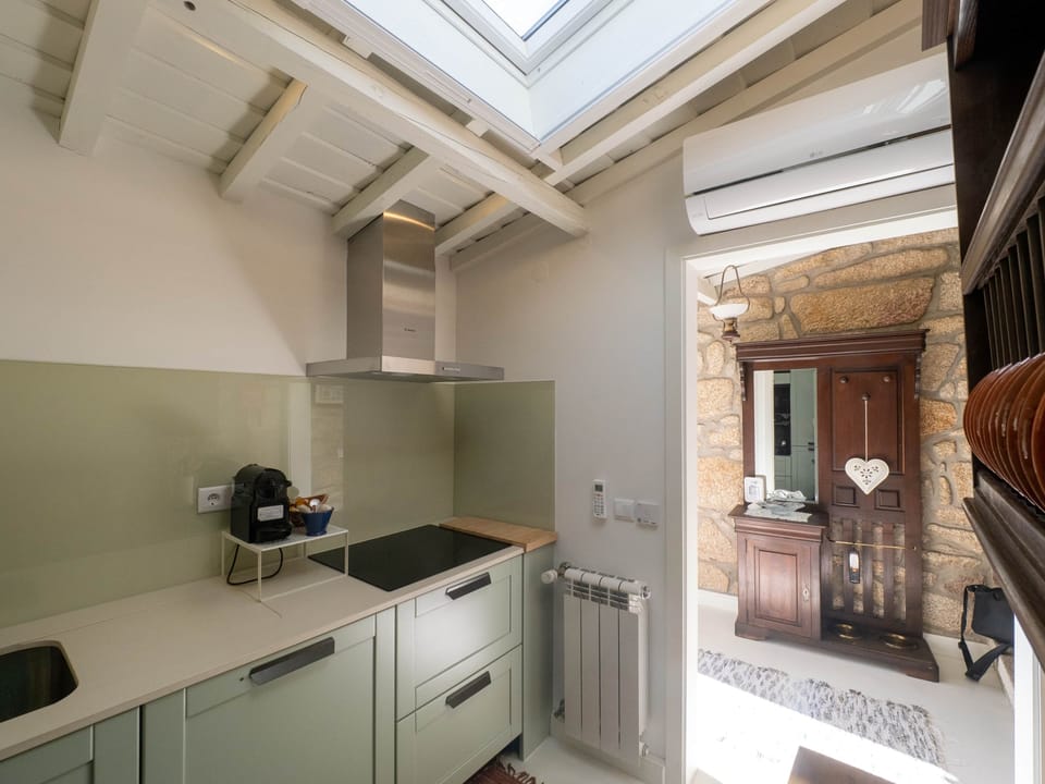 The kitchen blends modern amenities with classic touches that honour the cottage's heritage.
