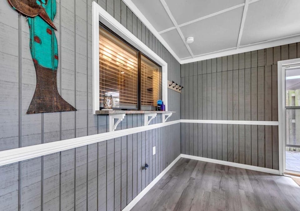 Bright sunroom with charming wood accents and natural light