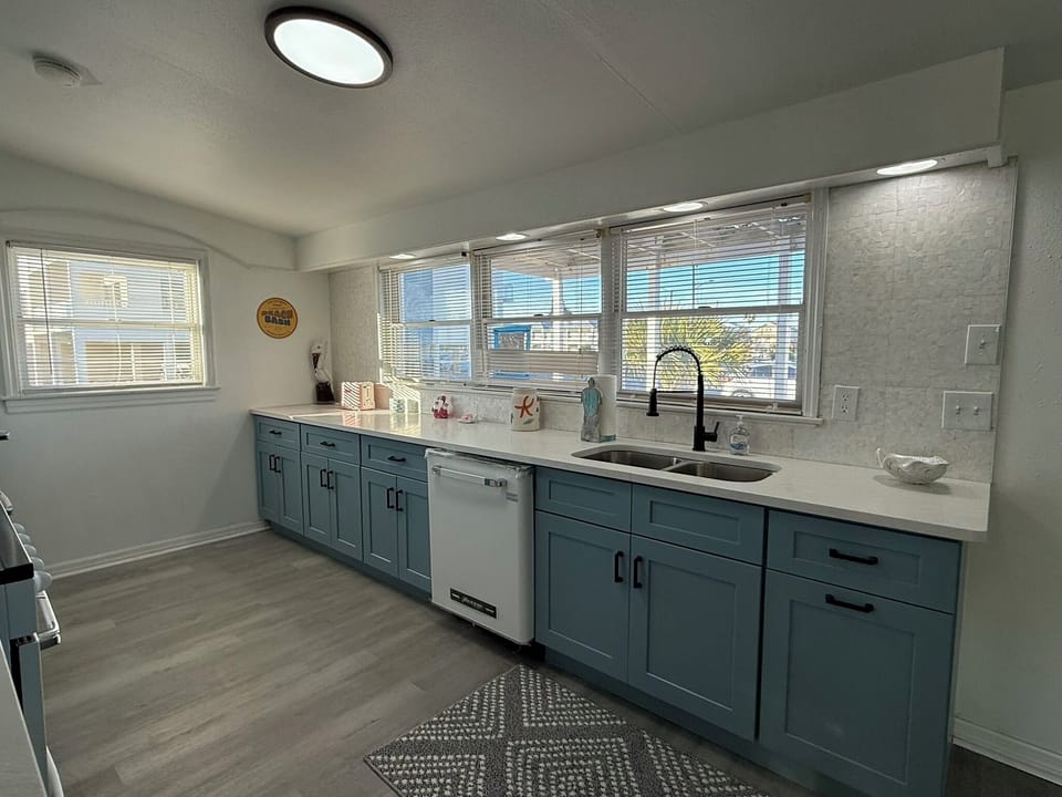 Blue Kitchen Cabinets with Retro Appliances and Mother of Pearl Backsplash!