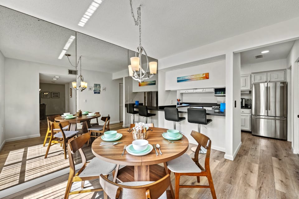 Kitchen counter seating with sleek stools at the breakfast bar, perfect for casual dining or morning coffee.