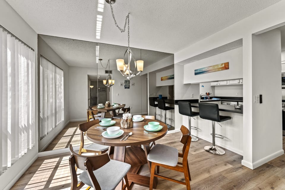 Dining area with natural light flooding in, featuring a cozy table set for gatherings and meals filled with laughter.