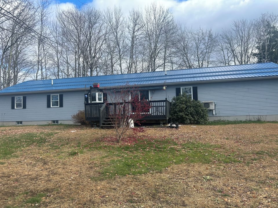 Back of house with large deck perfect for grilling.
