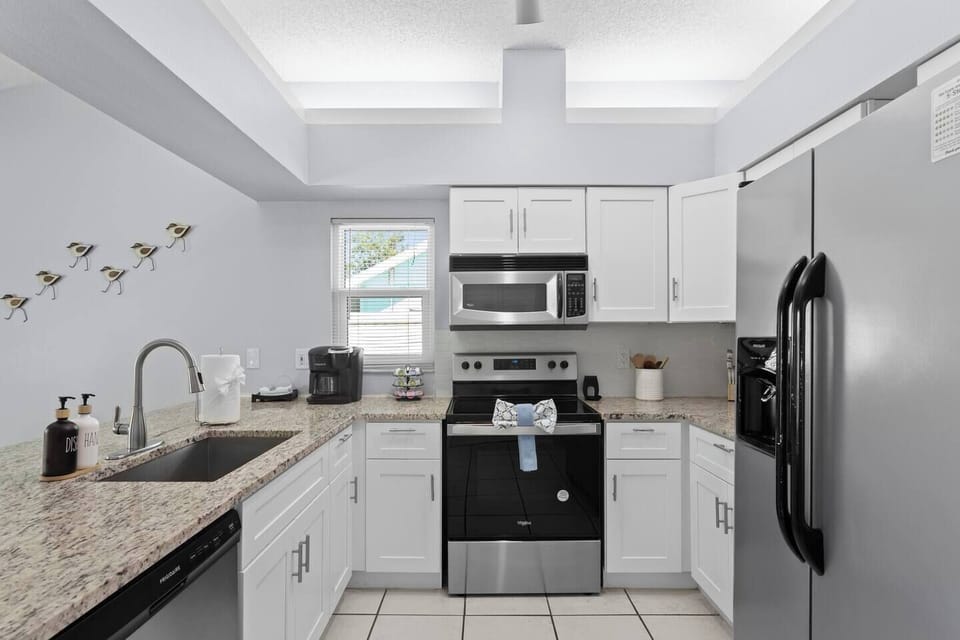 Bright Kitchen: Whip up culinary delights with stunning views and modern, sleek appliances!