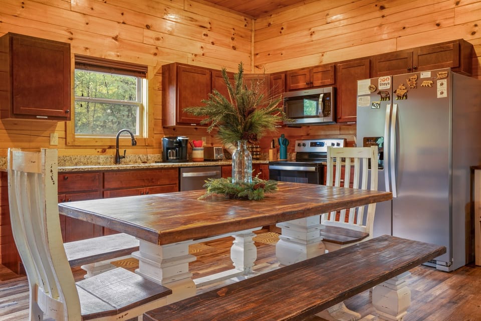 Enjoy meals together in the open dining and kitchen area, designed for both comfort and convenience.