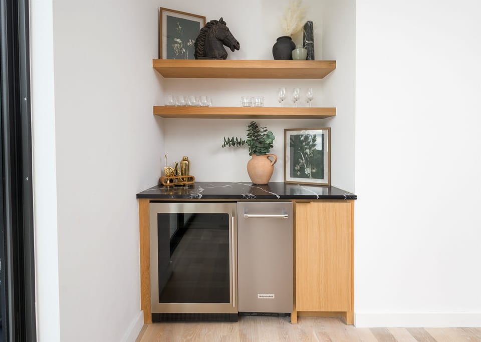 Wet Bar Delight: Sip and savor in this stylish mini bar, perfect for evening refreshments!