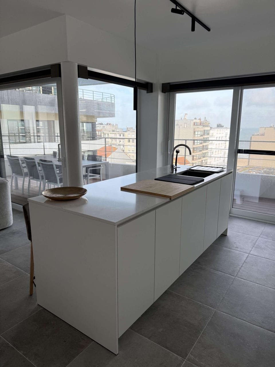 Sleek kitchen with open design, cook while enjoying the view.