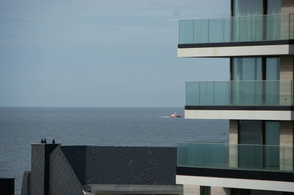 Wide terrace with glass railing, enjoy fresh sea breezes.