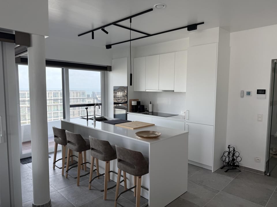 Modern kitchen island for cooking and social gatherings.