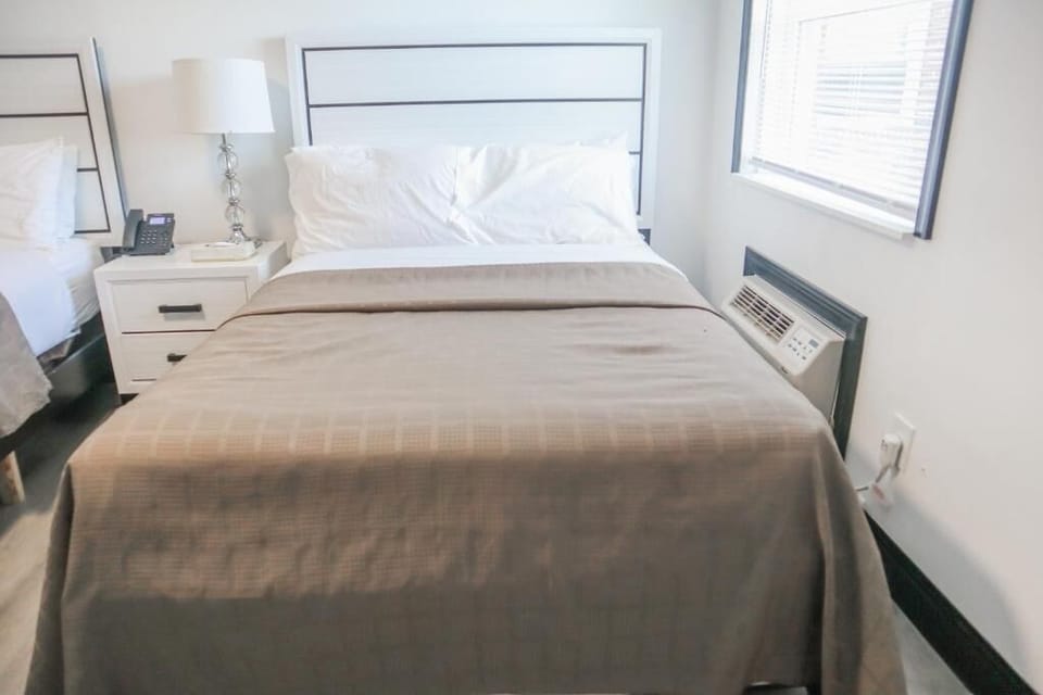 Sink into crisp linens for a quiet, restful sleep.