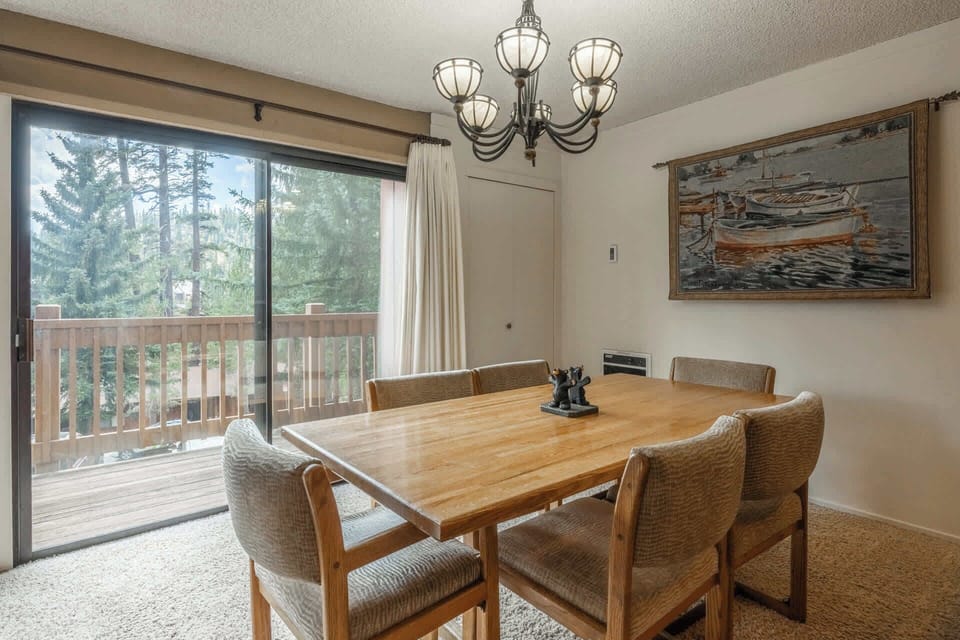 Dining area seats 6 w/ balcony access