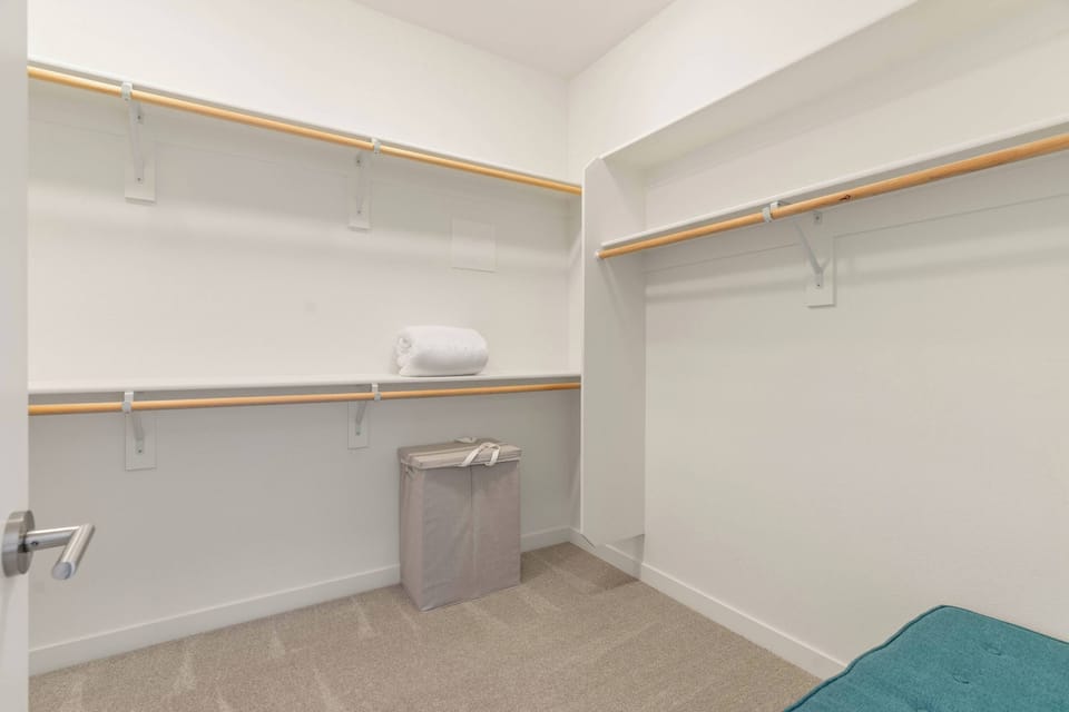 Spacious walk-in closet with plenty of storage for extended stays.