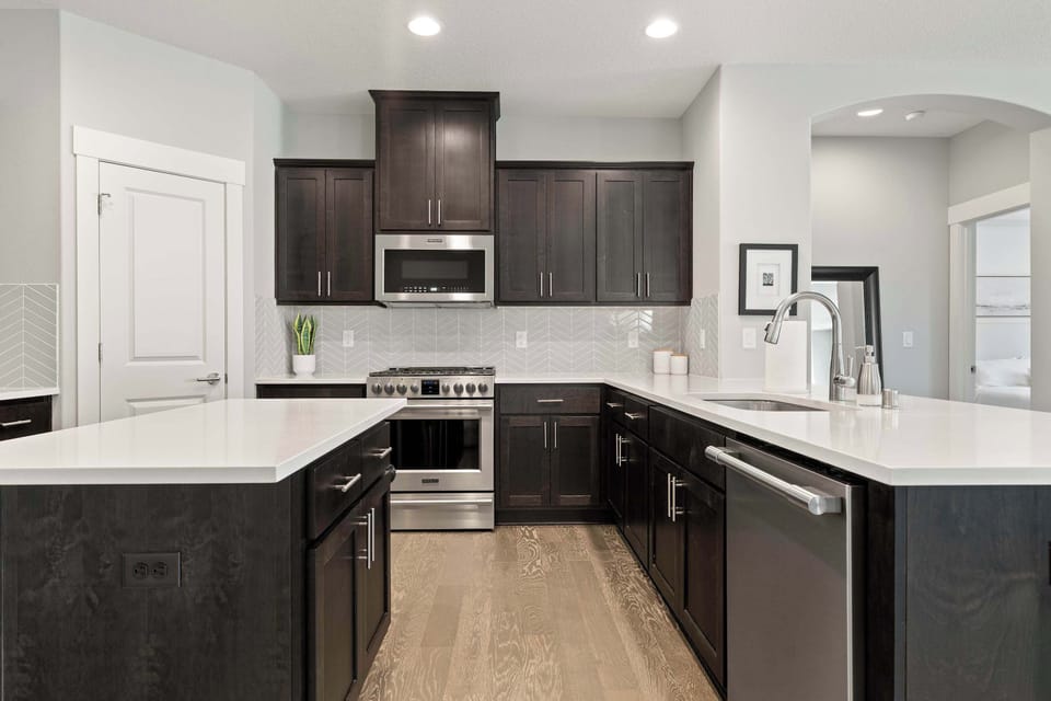 Stainless steel appliances and abundant counter space create a chef-friendly kitchen.